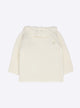 Baby top with ruffle neckline