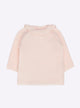Baby top with ruffle neckline