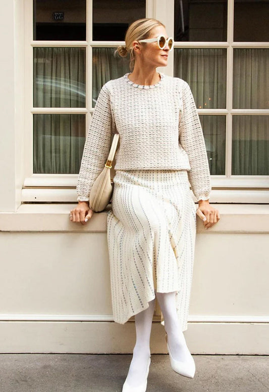 Kelly Rutherfod portant une jupe et un top en maille fine assorti Molli
Kelly Rutherford : jupe longue en maille et un pull en maille fine Molli