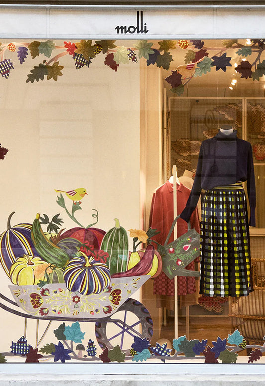Vitrine magasin Molli : Vêtements en maille fine sur portant